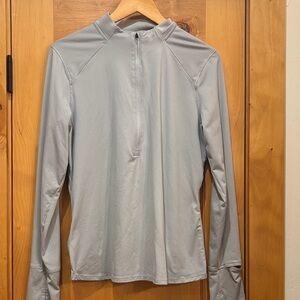 Women’s Under Armour Gray Long Sleeve Quarter-Zip Running pullover.